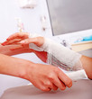 Bandaging patient in hospital.