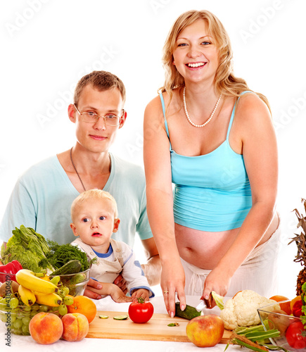 Photo: Family pregnant woman preparing food . Family pregnant woman preparing food .