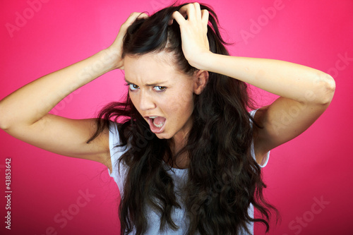 Photo: very angry frustrated young woman very angry frustrated young woman