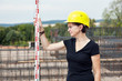 Construction worker on site at the measure