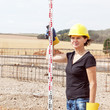Foto: Construction worker on site at the measure Construction worker on site at the measure