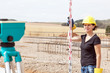 Construction worker on site at the measure