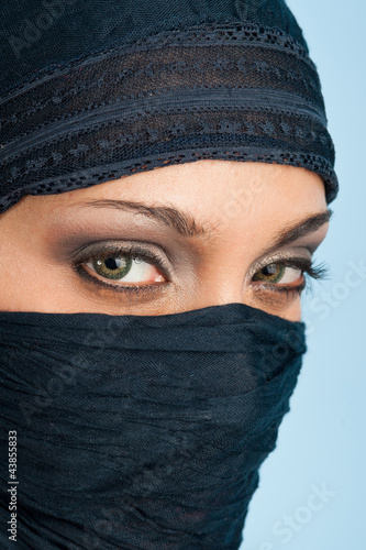 Photo: Portrait of veiled woman, focus on eyes. Portrait of veiled woman, focus on eyes.