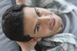 Man lying on a couch and smiling
