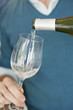 Man pouring wine in a wine glass