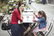Woman with her daughter sitting in a cafe