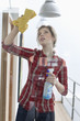 Woman cleaning a glass door