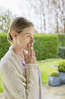 Woman smoking cigarette in park