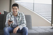Man changing channels with a remote control
