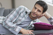 Portrait of a man lying on a couch