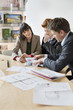 Real estate agent discussing property documents to his clients