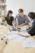 Real estate agent discussing property documents to his clients