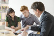 Real estate agent discussing property documents to his clients