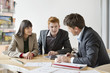 Real estate agent discussing property documents to his clients