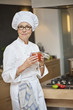 Woman holding a jar of tomato sauce