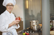 Woman holding a jar of tomato sauce