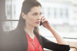 Woman traveling in a bus and talking on a mobile phone