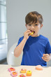 Boy eating a cup cake