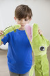 Boy playing with animals toys
