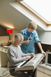 Man playing an electric piano with his son at home