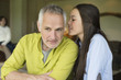 Girl whispering to her father