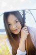 Portrait of a happy girl holding an umbrella