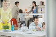 Family setting table for dinner