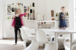 Man and woman standing beside a dining table at home