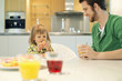 Man and daughter at breakfast table