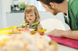Man and daughter at breakfast table