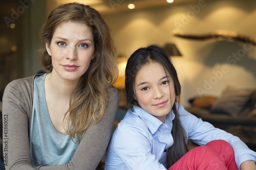 Photo: Portrait of a woman smiling with her daughter Portrait of a woman smiling with her daughter