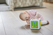 Baby girl playing with a musical block toy