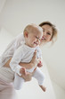 Woman playing with her daughter and smiling