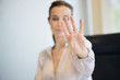 Businesswoman showing her wedding ring