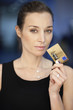 Portrait of a businesswoman holding a credit card