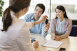 Couple receiving keys from business executive