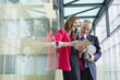 Business executives discussing in an office corridor