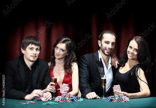 Photo: friends drinking and celebrating a gambling night friends drinking and celebrating a gambling night