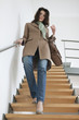 Woman moving down stairs