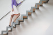 Woman moving up stairs