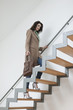 Woman moving up stairs