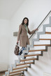 Woman moving up stairs