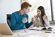 Business people showing fist and smiling