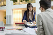 Fashion designers discussing in an office