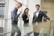 Business executives cheering up in an office
