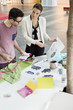 Fashion designers working in an office