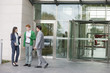 Business executives smoking in front of an office building