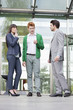 Business executives smoking in front of an office building