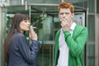 Business executives smoking in front of an office building