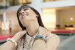 Close-up of a businesswoman suffering from neckache